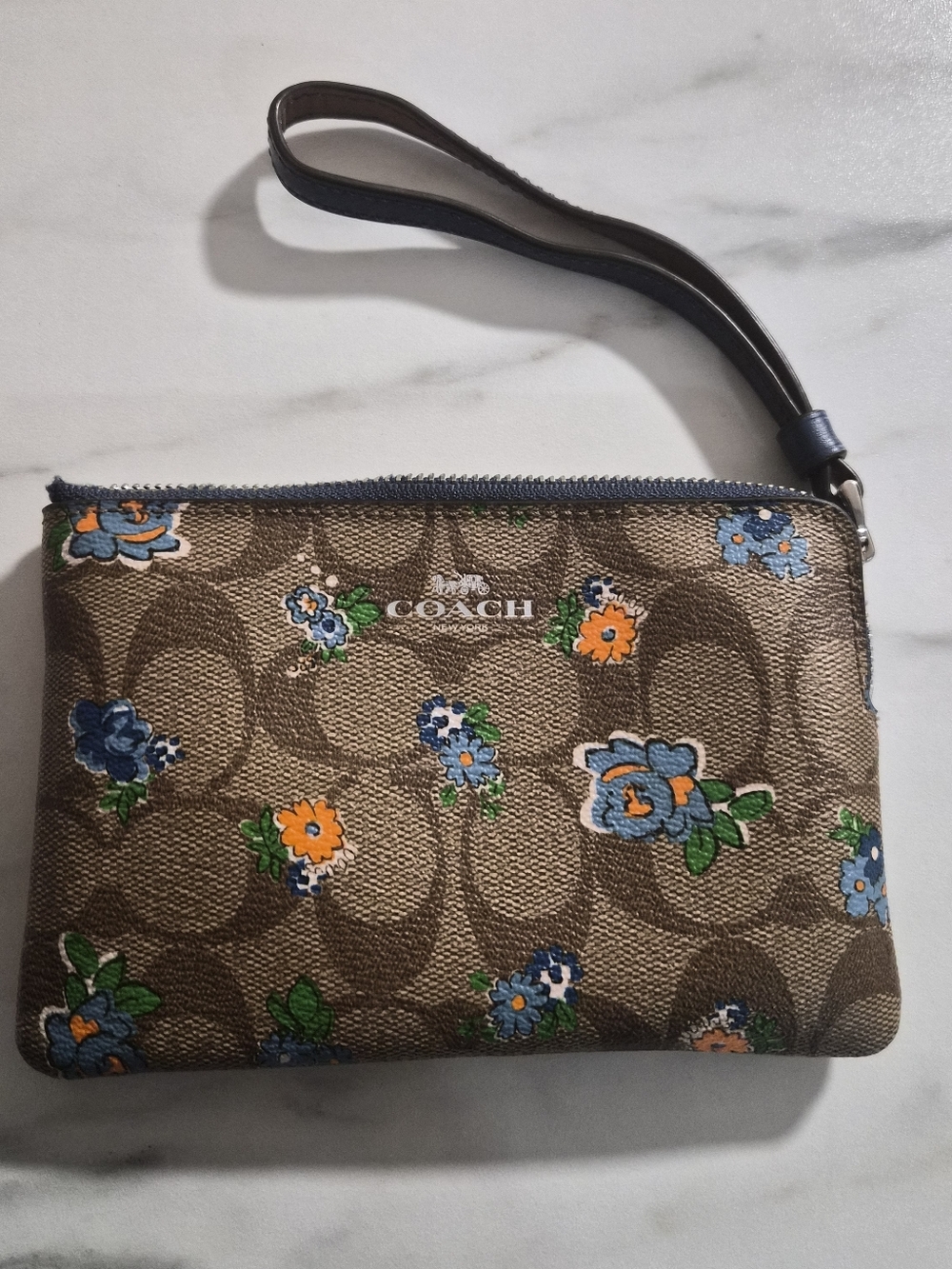 Coach Brown Signature Floral Wristlet with Blue & Orange Accents